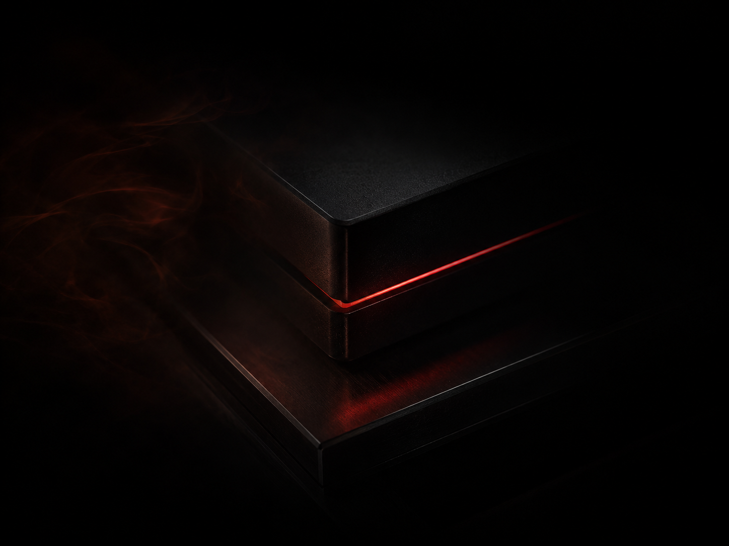 LOCKD. matte-black device with a signature glowing red seam, shown in shadow
